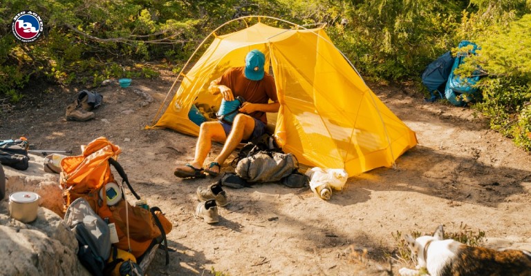 A flat area with a set-up camp