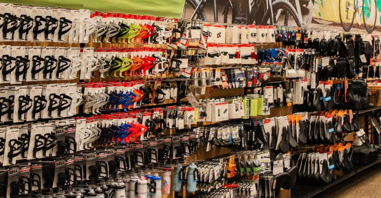 a wall of bike accessories at a scheels bike shop