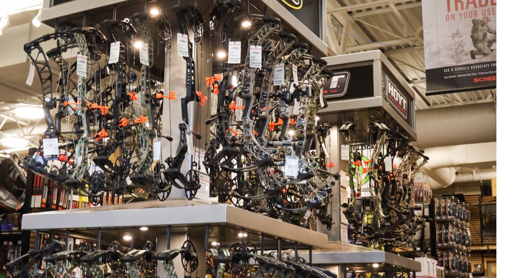 a variety of bows at the appleton archery shop