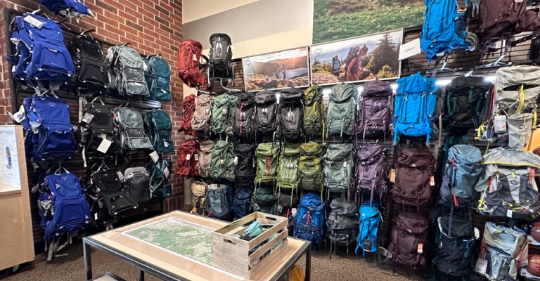 a wall of backpacking packs at johnstown scheels