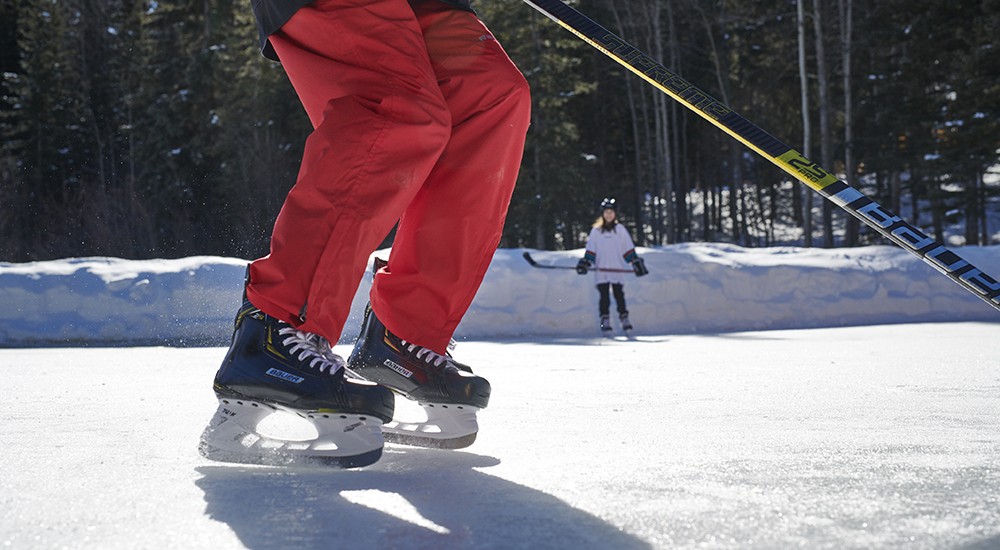 Hockey player wearing Bauer hockey skates