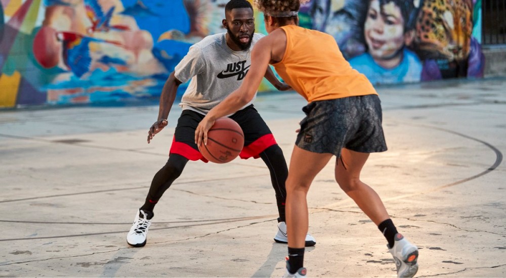 a player dribbling the basketball on the court