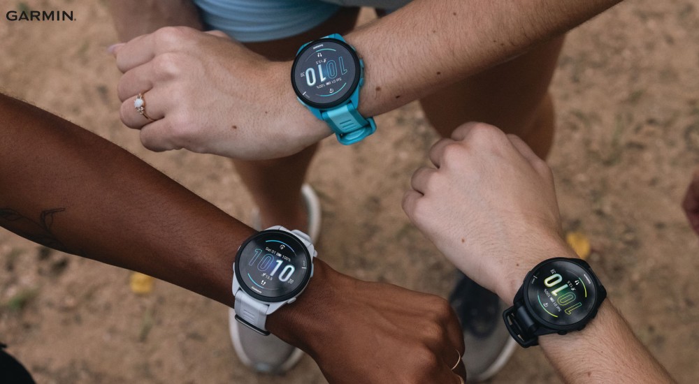 three different runners wearing a garmin watch