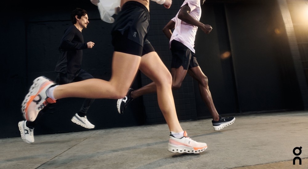 two runners wearing brooks while running outdoors