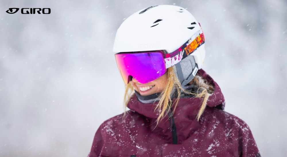 a woman wearing a ski helmet while it
