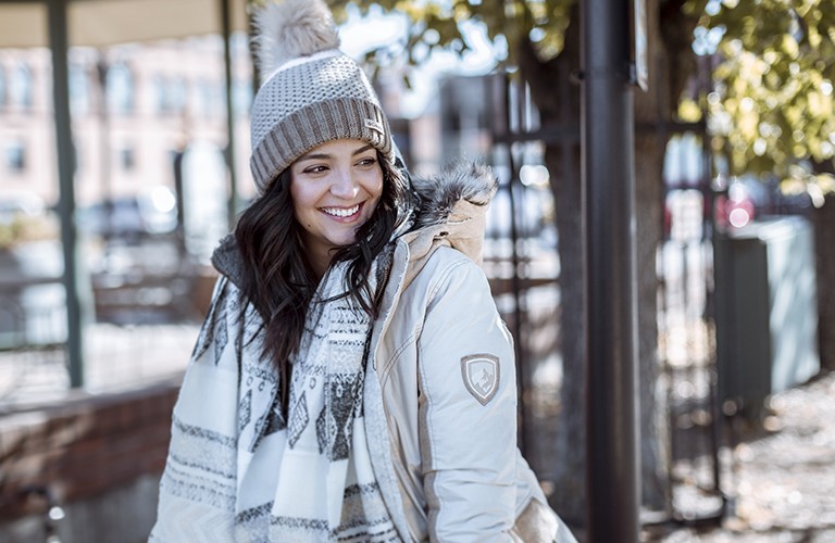 Woman wearing a winter jacket in cold weather