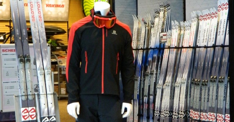 a variety of cross country ski equipment at a scheels store