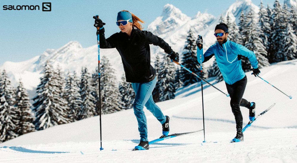 a couple cross country skiing outdoors