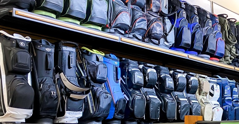 a variety of golf bags at the des moines scheels golf shop