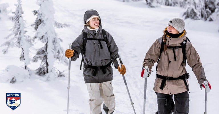 two girls skiing wearing hestra gloves