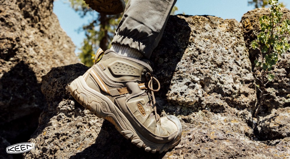 a person wearing hiking boots when out on the trail