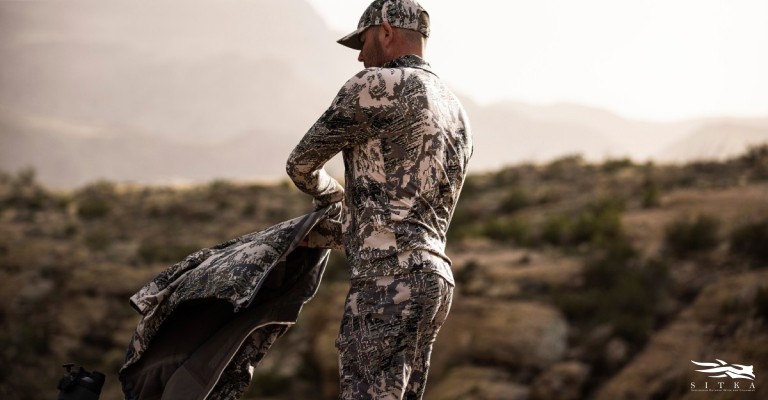a hunter wearing a base layer out in the field