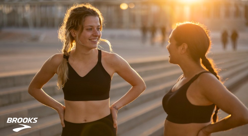 two women wearing sports bras out on a run