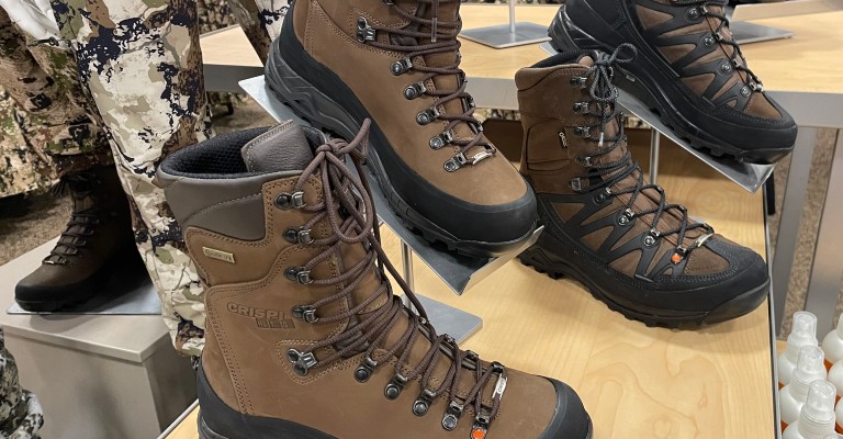 hunting boots on a table within iowa city scheels hunting shop