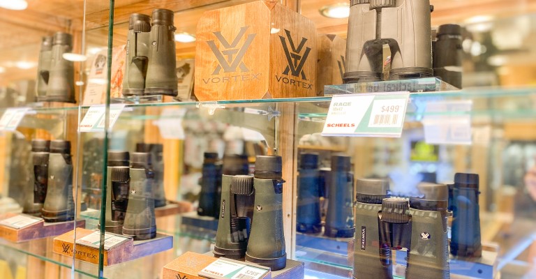 an optics display at iowa city scheels hunting shop