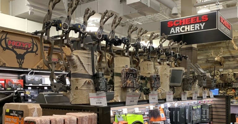 a selection of treestands and trail cameras at the archery shop