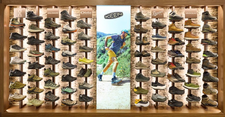 a wall of hiking boots at meridain scheels