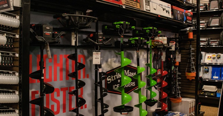 a collection of ice augers on display at st cloud scheels ice fishing shop