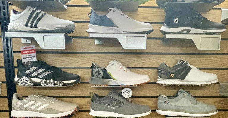 a display of golf shoes at the overland park scheels
