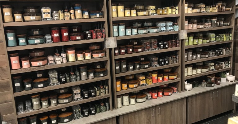 picture of a wall full of candles and diffusers