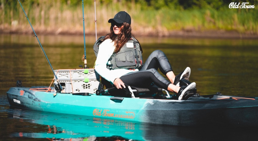 a girl fishing from a sit on top kayak