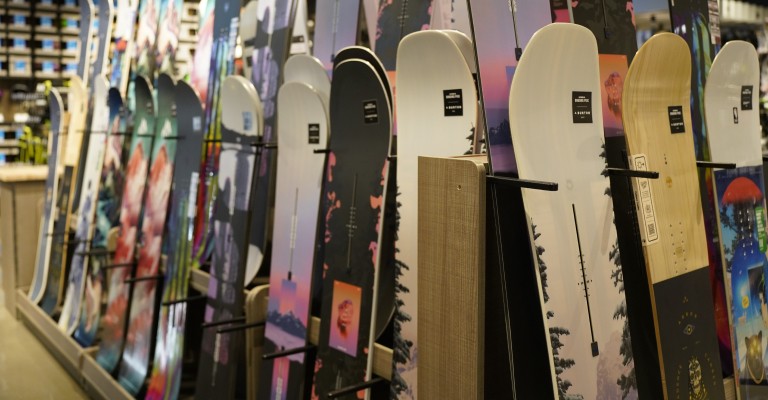 a variety of snowboards at a scheels location
