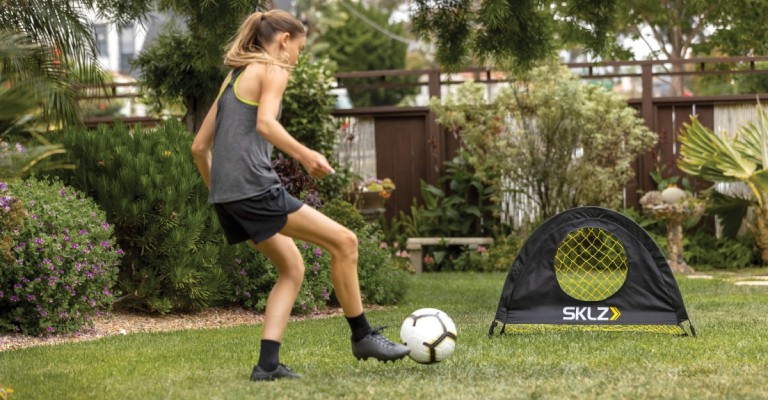 image of girl practicing soccer