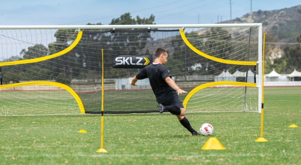 A soccer player practicing shooting drills