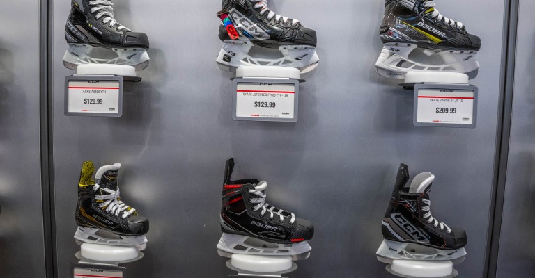 picture of wall full of hockey skates