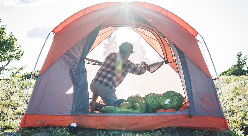 A man setting up the tent