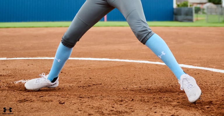 a player wearing softball cleats on the field