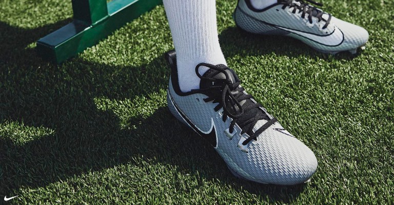 a player wearing football cleat before practice