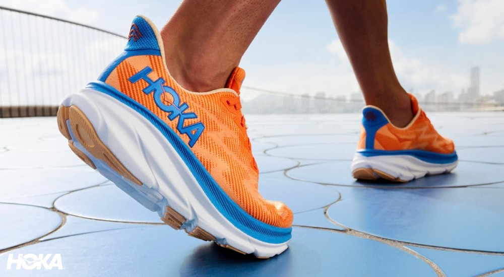 a close up of a hoka shoe on a runner